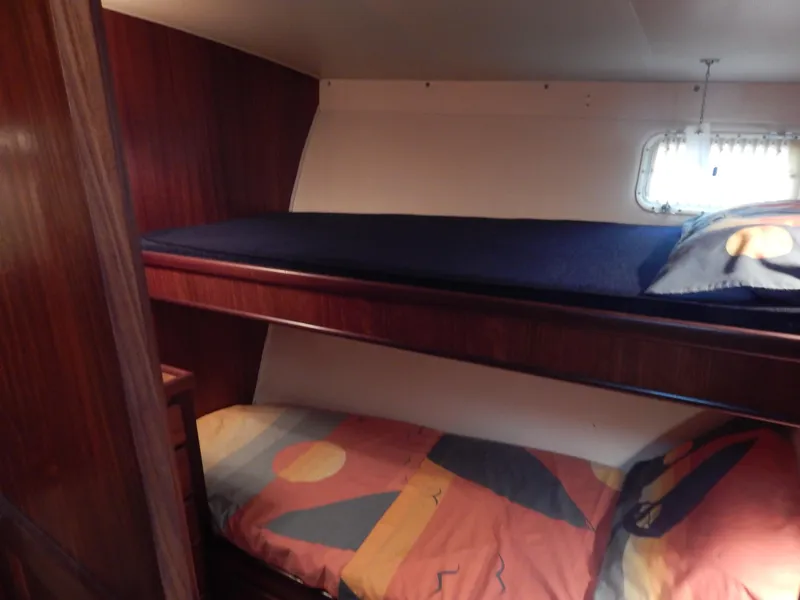 Slide: The Image of Bunk beds in 1972 Hatteras 38 Convertible yacht cabin with colorful bedding. - 13