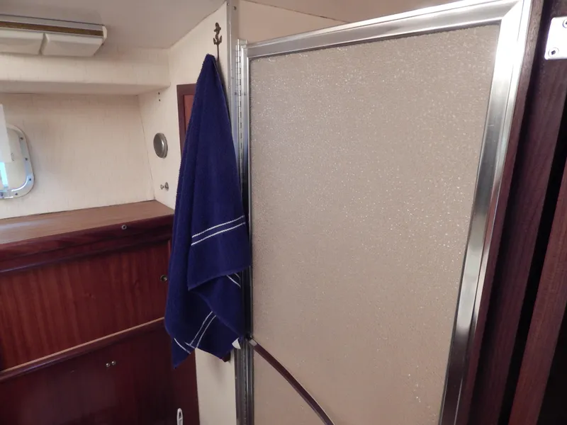 Slide: The Image of Interior of 1972 Hatteras 38 Convertible yacht with shower and blue towel. - 18