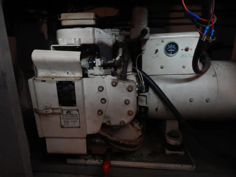 Slide: The Image of Engine compartment of 1972 Hatteras 38 Convertible boat with visible machinery and wiring. - 21