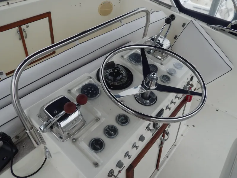 Slide: The Image of 1972 Hatteras 38 Convertible boat helm with steering wheel and control panel. - 6