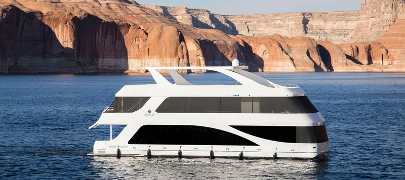 Slide: The Image of Luxury yacht Adonia on water with stunning rock formations, 2018. - 1