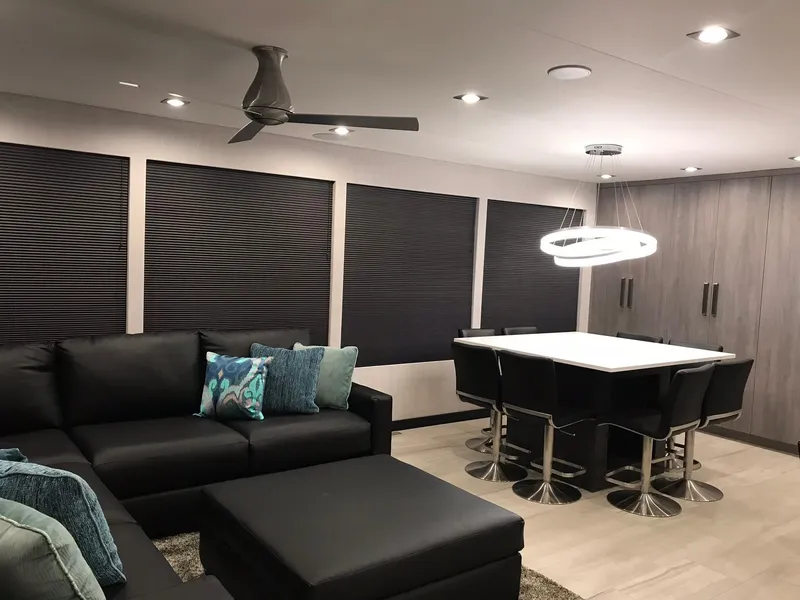 Slide: The Image of Modern living room with black sofa and dining table, Adonia Del Sol 2018. - 12