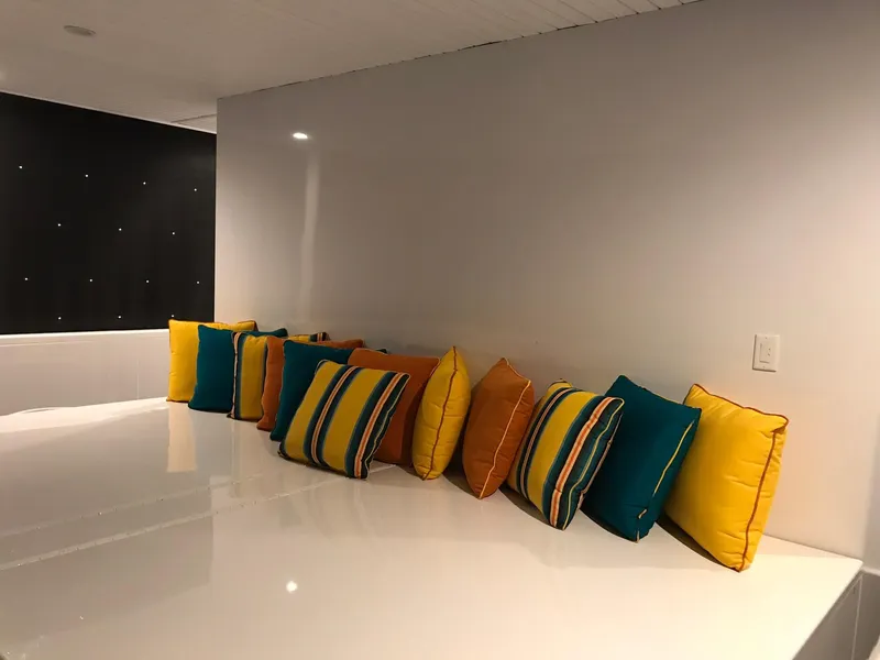 Slide: The Image of Colorful cushions on white bench, Adonia Del Sol Trip 2018. - 14