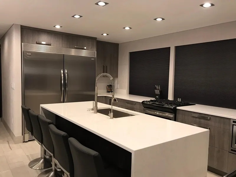 Slide: The Image of Modern kitchen with island, stainless steel appliances, and stylish chairs, 2018. - 17