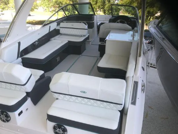 Slide: The Image of 2022 Regal 29 OBX boat interior with white seating and modern design. - 11