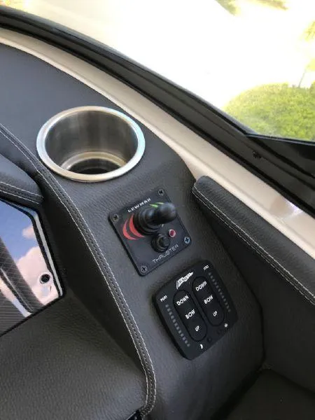 Slide: The Image of 2022 Regal 29 OBX boat console with joystick and control panel. - 7