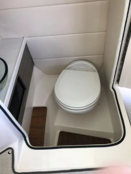 Slide: The Image of 2022 Regal 29 OBX boat interior bathroom with modern toilet design. - 9