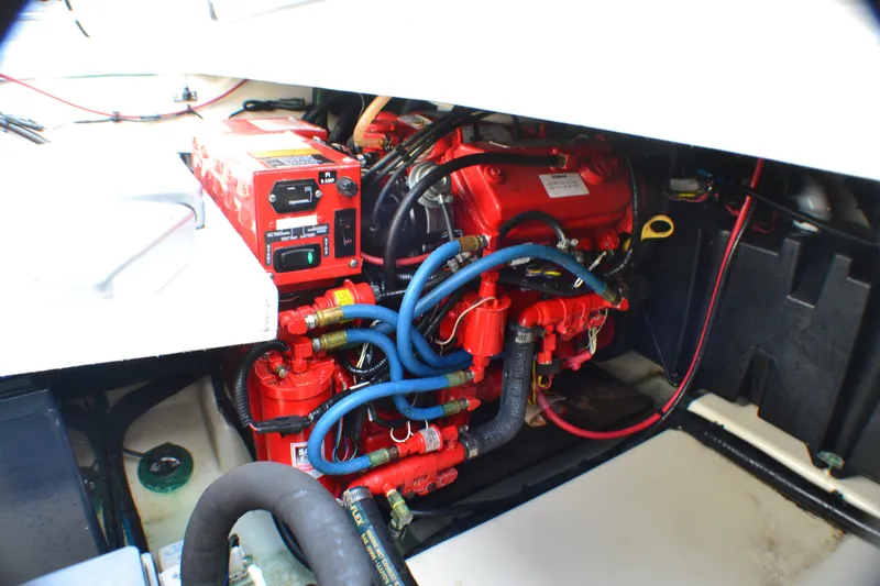 Slide: The Image of 2016 Boston Whaler 315 Conquest boat with canopy, docked in marina. - 11