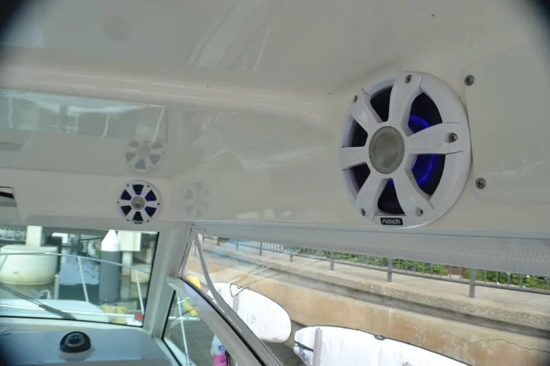 Slide: The Image of 2016 Boston Whaler 315 Conquest boat interior with seating and storage. - 8