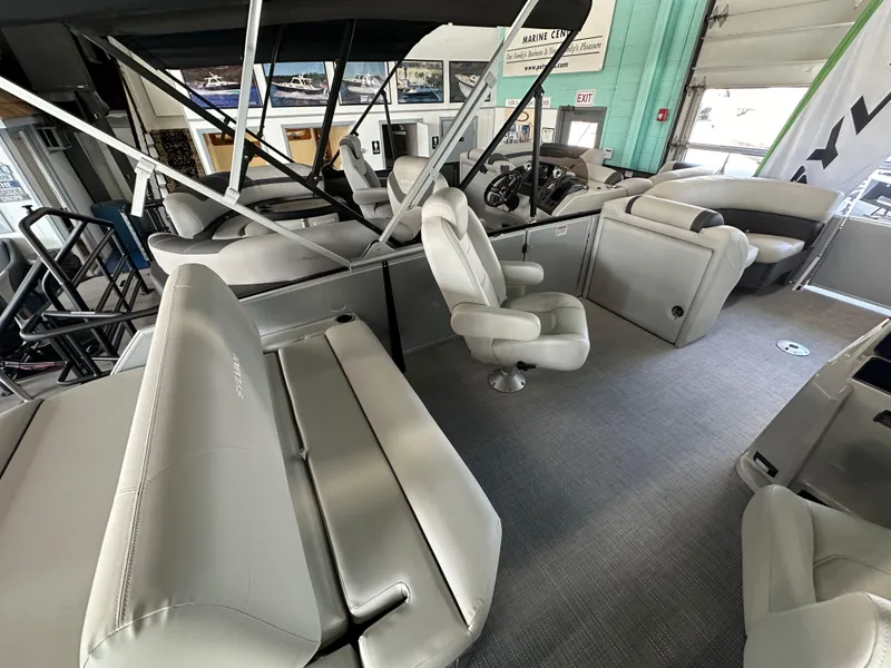 Slide: The Image of 2025 Sylvan Mirage 8522 CLZ DH pontoon boat interior with modern seating and helm. - 6