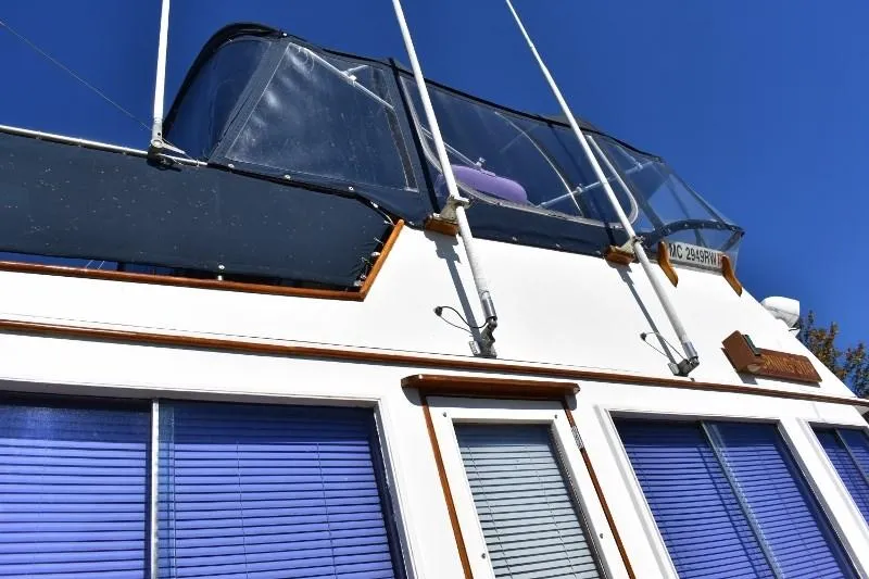 Slide: The Image of 1985 Grand Banks 49 Motoryacht with blue blinds. - 10
