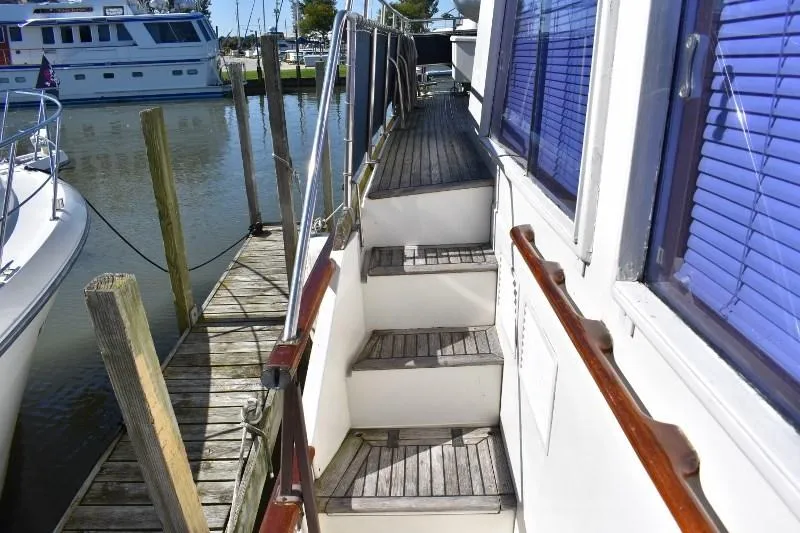 Slide: The Image of Stairway on a 1985 Grand Banks 49 Motoryacht at the dock. - 12