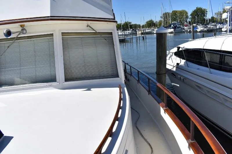 Slide: The Image of 1985 Grand Banks 49 Motoryacht docked, side view. - 19