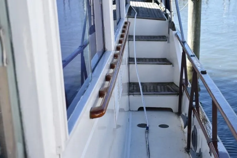Slide: The Image of Walkway of 1985 Grand Banks 49 Motoryacht with wooden railing. - 21