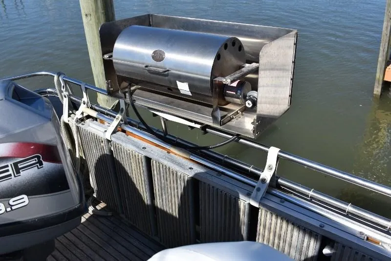 Slide: The Image of Grill on a 1985 Grand Banks 49 Motoryacht by the water. - 24