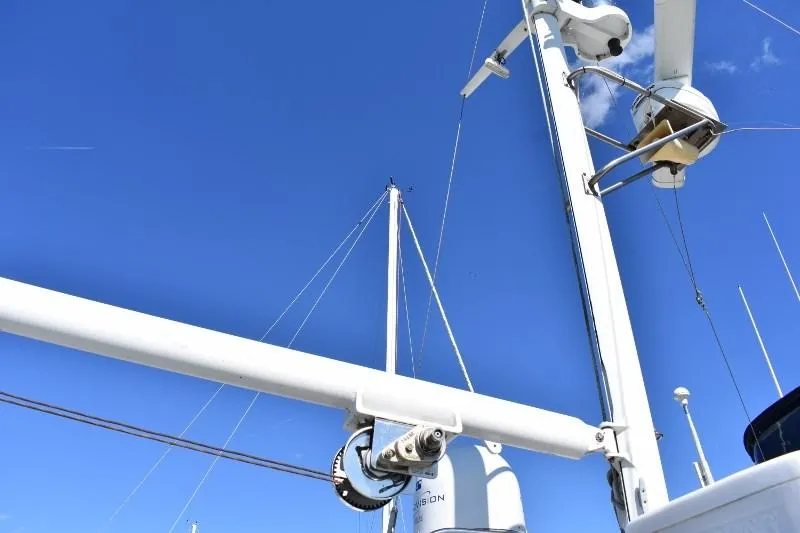 Slide: The Image of Masts and equipment of 1985 Grand Banks 49 Motoryacht against blue sky. - 29