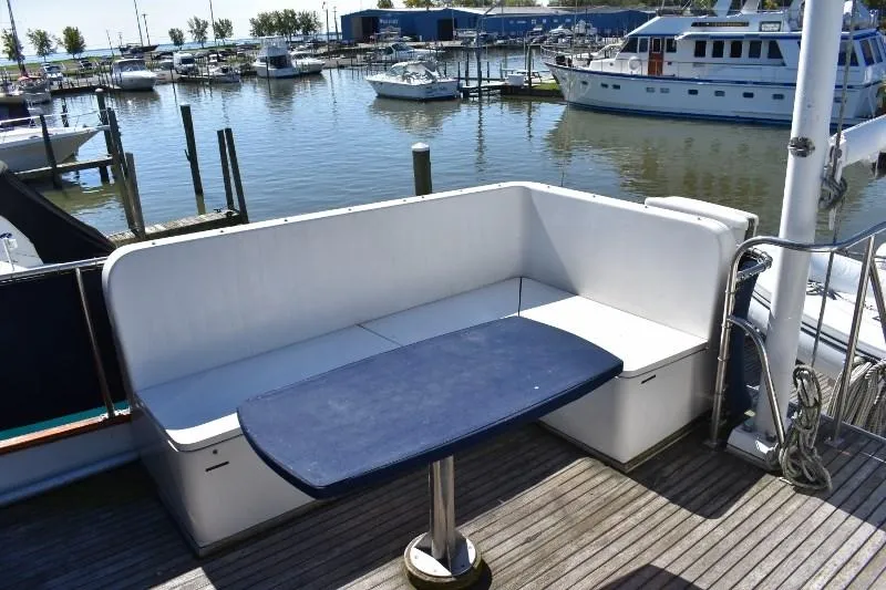 Slide: The Image of Seating area on a 1985 Grand Banks 49 Motoryacht in the harbor. - 34