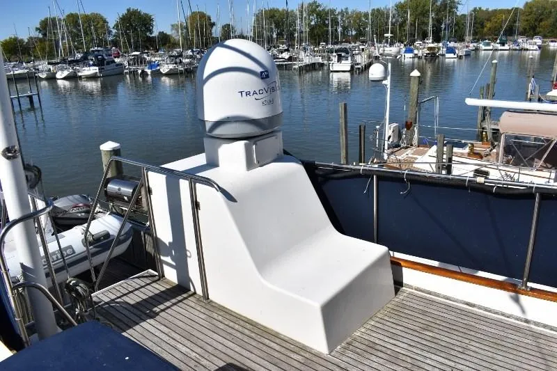 Slide: The Image of 1985 Grand Banks 49 Motoryacht docked with TracVision antenna. - 35