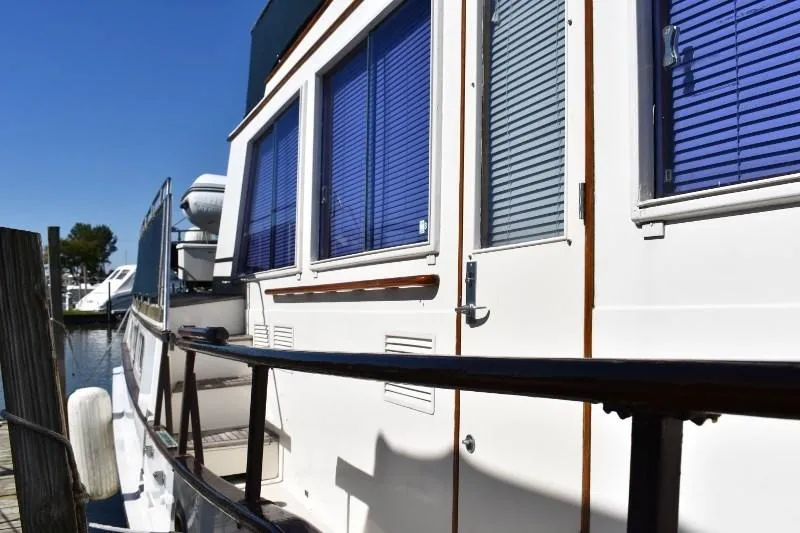 Slide: The Image of Side view of 1985 Grand Banks 49 Motoryacht at dock. - 6