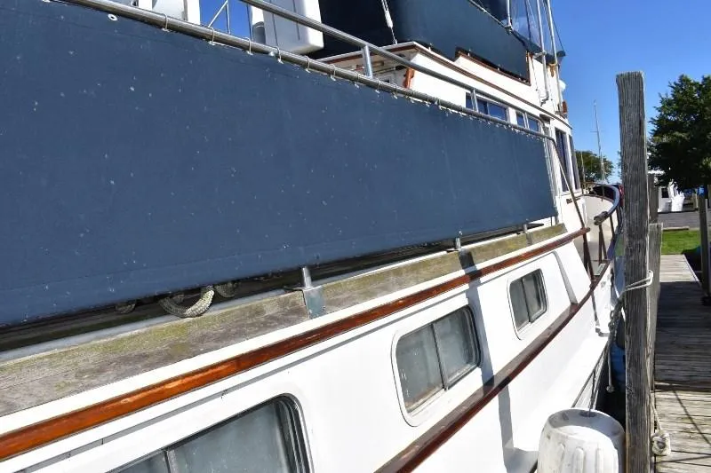 Slide: The Image of 1985 Grand Banks 49 Motoryacht docked at marina. - 9