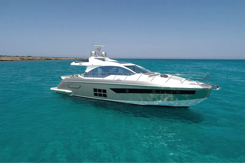 Slide: The Image of Azimut S6 2023 luxury yacht on clear turquoise water. - 2