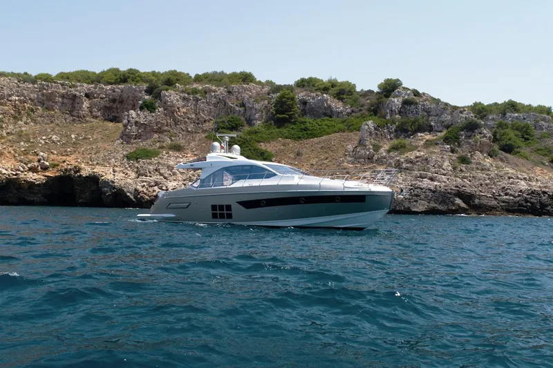 Slide: The Image of 2023 Azimut S6 yacht cruising near rocky coastline. - 4