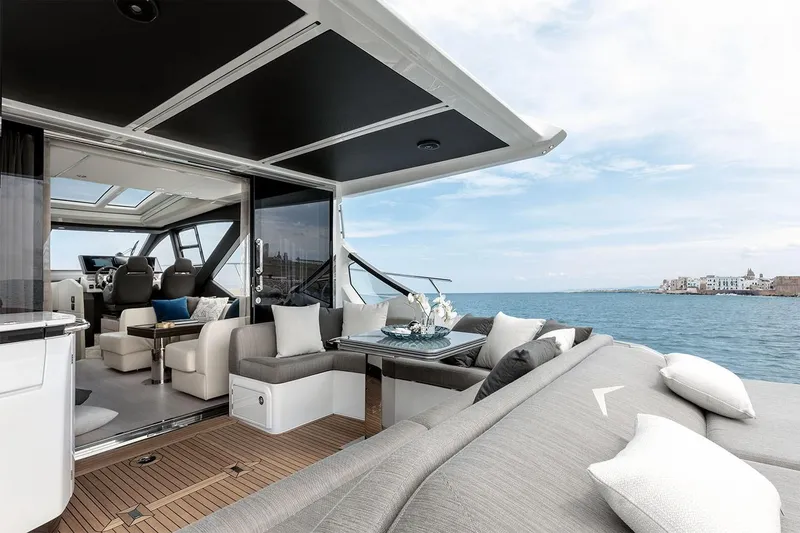 Slide: The Image of Luxurious 2023 Azimut S6 yacht interior with ocean view and modern seating area. - 7