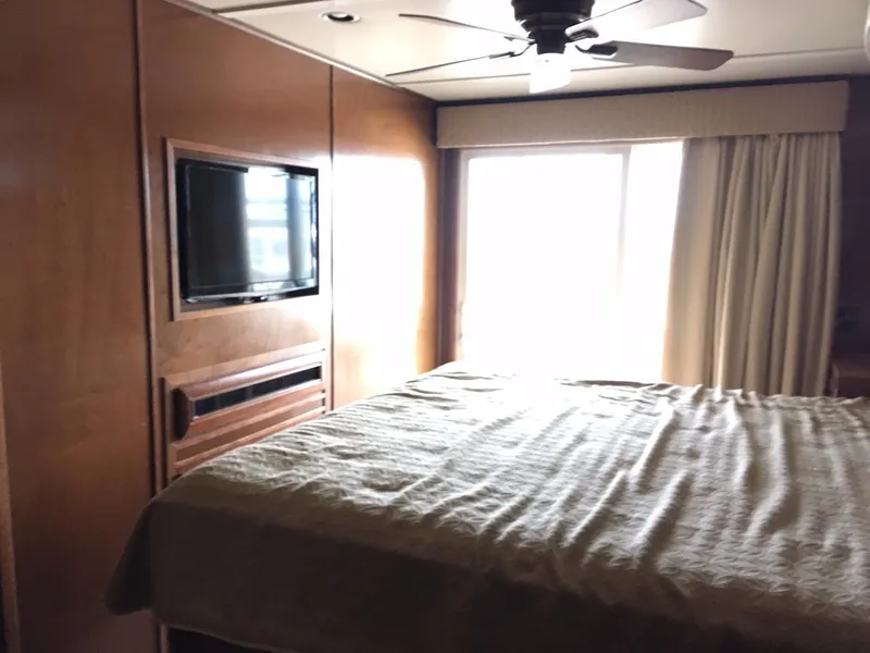 Slide: The Image of Luxurious bedroom with TV and large window, Bravada 2012. - 10