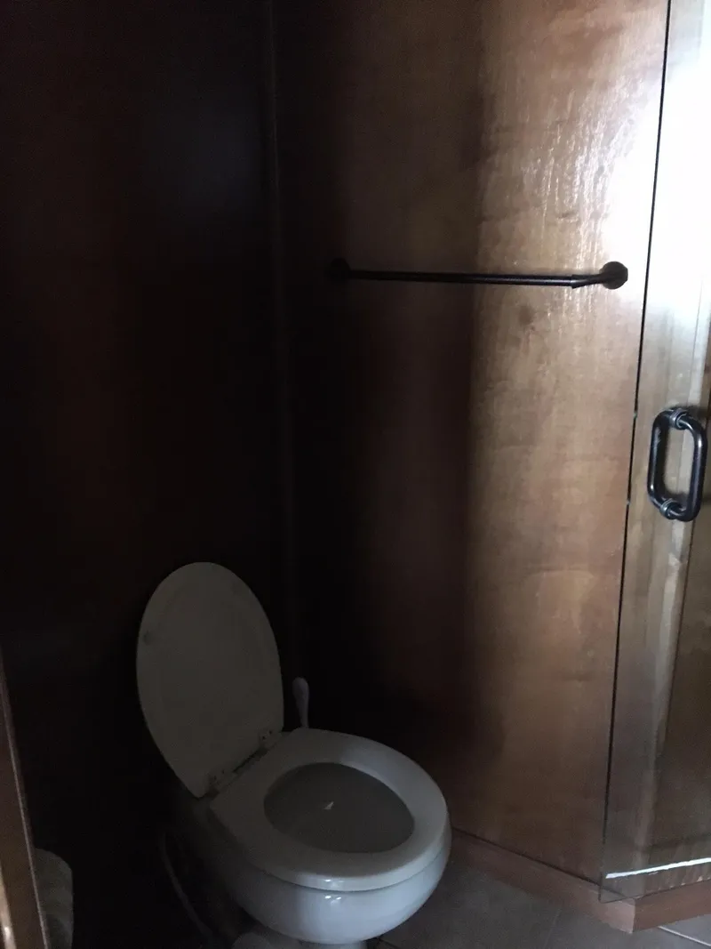 Slide: The Image of Wood-paneled bathroom with toilet, Bravada Summer Solstice Trip 2012. - 12