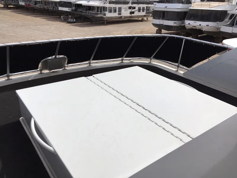 Slide: The Image of Bravada houseboat on summer trip, 2012, with other boats in background. - 17