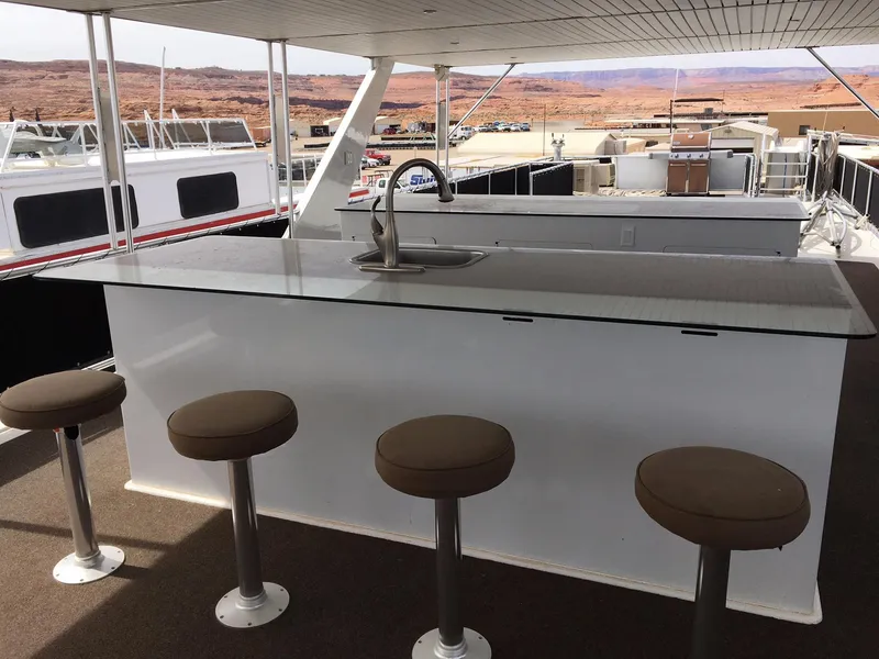 Slide: The Image of Bravada houseboat with bar and stools, summer 2012. - 19