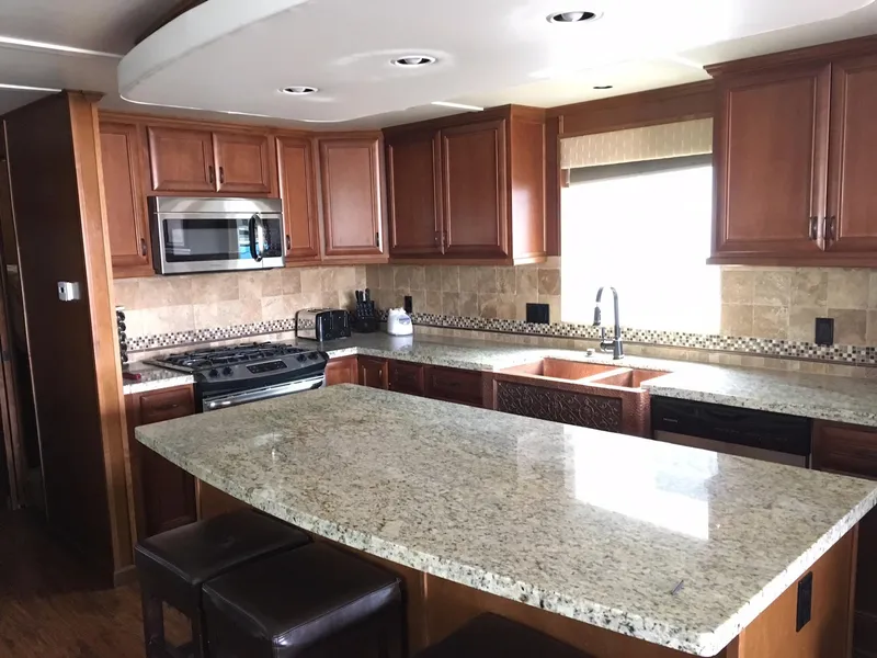 Slide: The Image of Modern kitchen with granite countertops and wooden cabinets, Bravada 2012. - 4