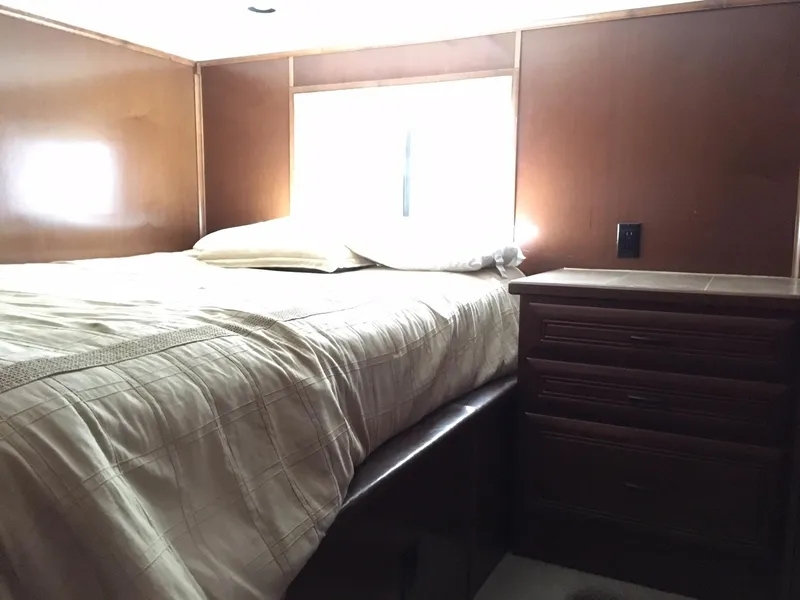 Slide: The Image of Cozy bedroom in Bravada RV, 2012 model. - 8