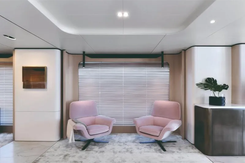 Slide: The Image of Modern interior of 2023 Azimut Grande 32 Metri yacht with pink chairs and large window. - 16