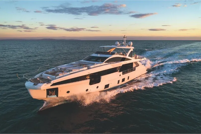 Slide: The Image of 2023 Azimut Grande 32 Metri luxury yacht cruising at sunset. - 22