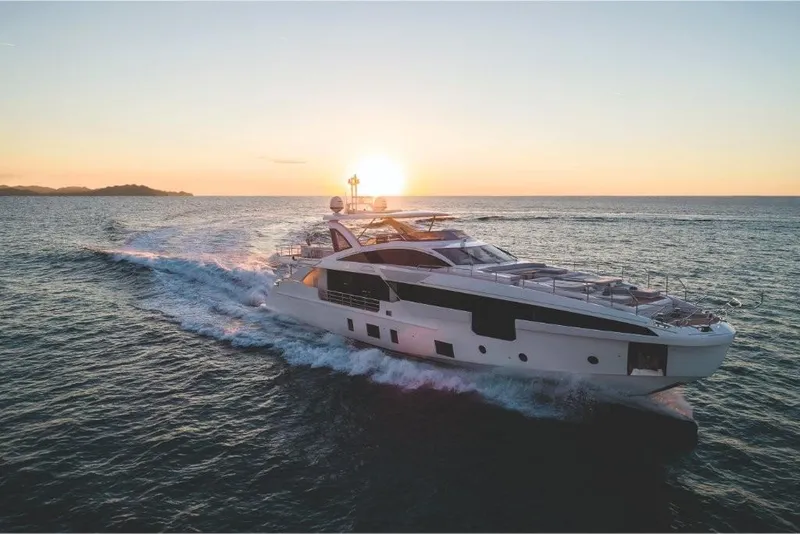 Slide: The Image of 2023 Azimut Grande 32 Metri yacht cruising at sunset. - 23