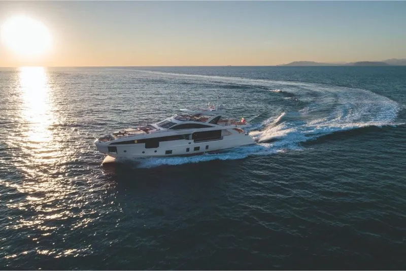 Slide: The Image of 2023 Azimut Grande 32 Metri yacht cruising at sunset. - 24