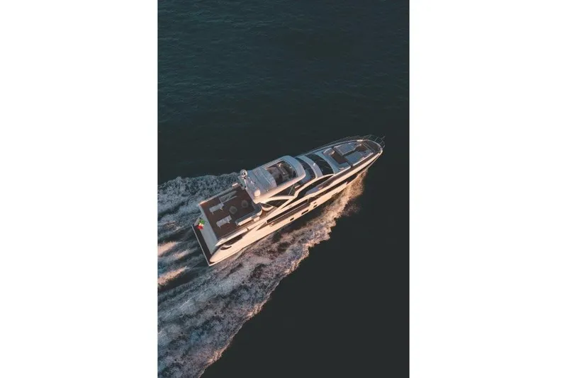 Slide: The Image of Aerial view of 2023 Azimut Grande 32 Metri luxury yacht cruising on the water. - 28