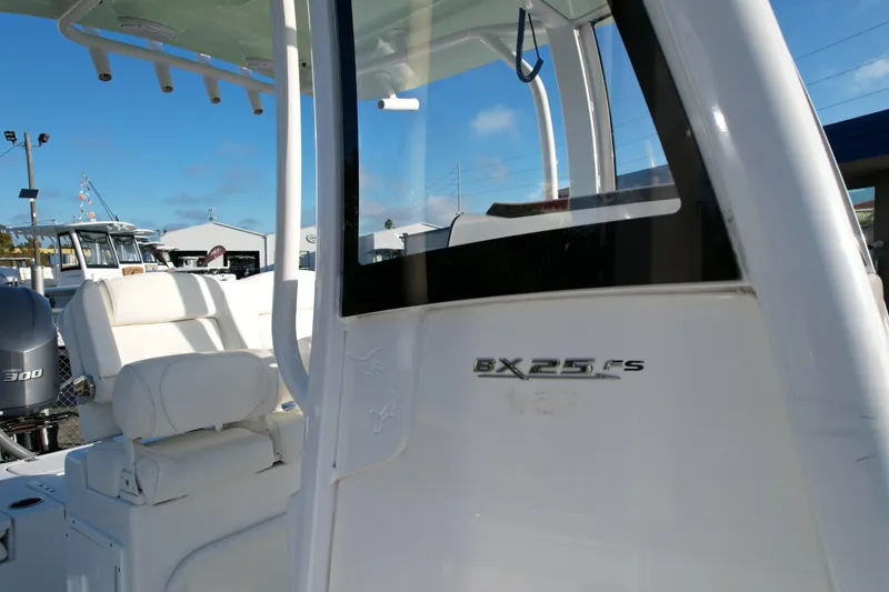 Slide: The Image of 2019 Sea Hunt BX 25 FS boat interior with seating and console details. - 3
