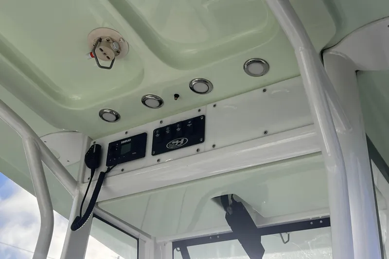 Slide: The Image of 2019 Sea Hunt BX 25 FS boat console with electronics and controls. - 9