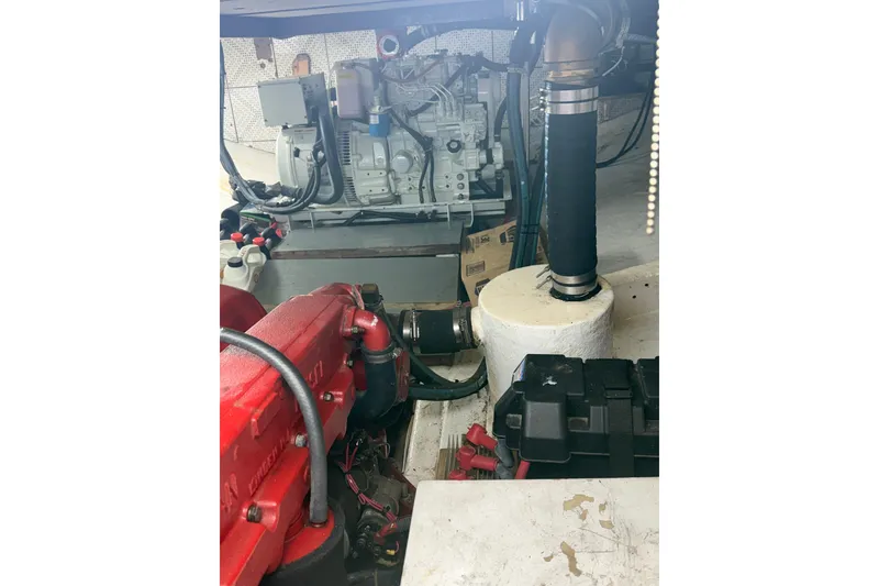 Slide: The Image of Engine room of a 1982 Krogen 42 boat, showcasing mechanical components. - 17