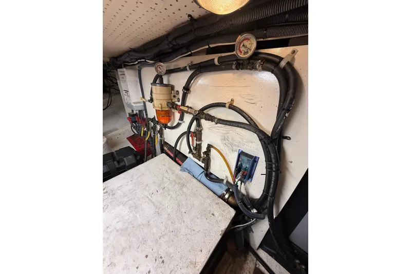 Slide: The Image of Engine room of 1982 Krogen 42 boat with gauges and wiring. - 19