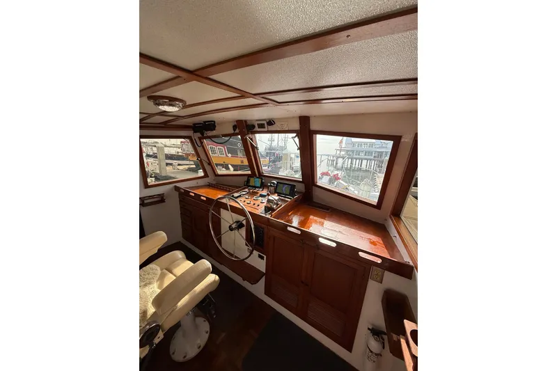 Slide: The Image of Interior of 1982 Krogen 42 boat with wooden helm and navigation equipment. - 21