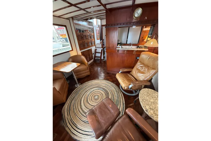Slide: The Image of Interior of 1982 Krogen 42 yacht with leather seating and wooden accents. - 6