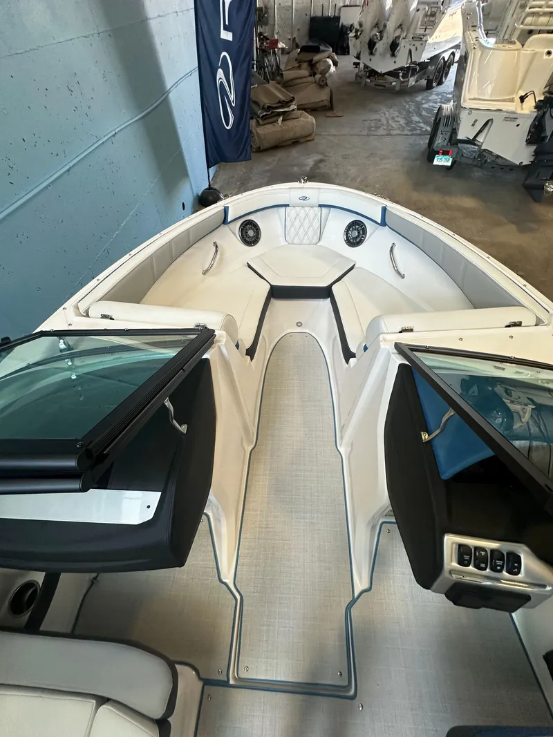 Slide: The Image of 2025 Regal 2000ES Bowrider dashboard with steering wheel and control panel. - 14