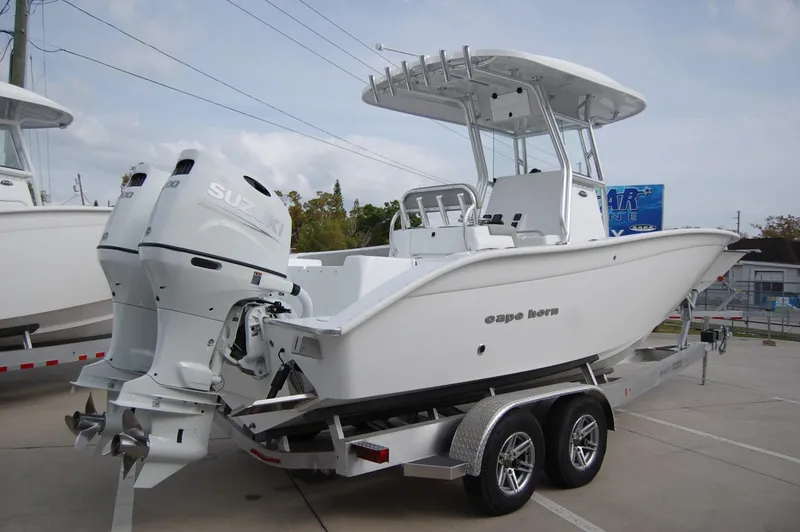 The Image of 2024 Cape Horn 24 XS boat on trailer with dual Suzuki outboard engines. - 0
