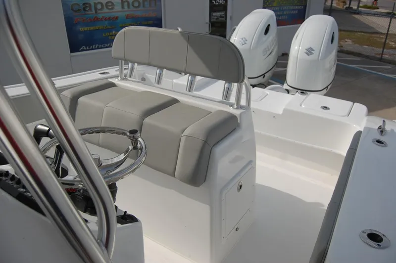 Slide: The Image of 2024 Cape Horn 24 XS boat interior with dual outboard engines. - 13