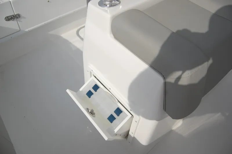 Slide: The Image of 2024 Cape Horn 24 XS boat interior with open storage compartment. - 15