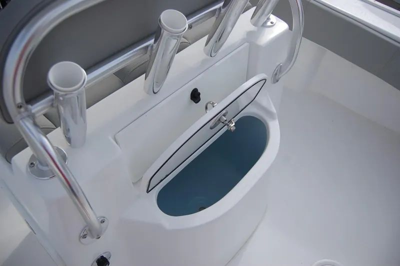 Slide: The Image of 2024 Cape Horn 24 XS boat interior with rod holders and storage compartment. - 19