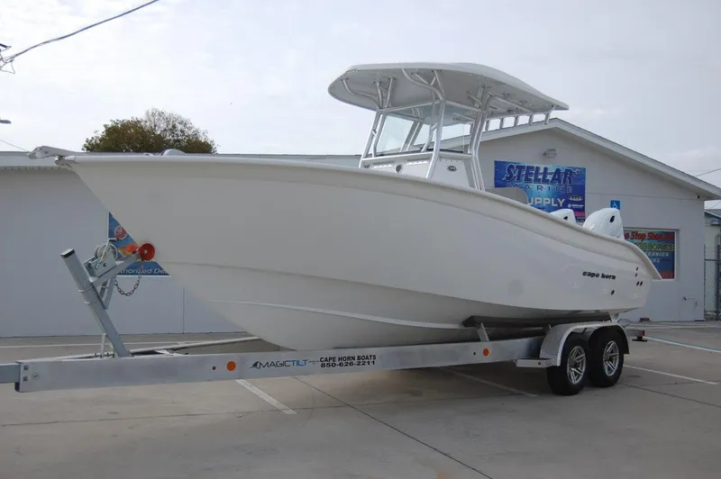 Slide: The Image of 2024 Cape Horn 24 XS boat on a trailer in a parking lot. - 4
